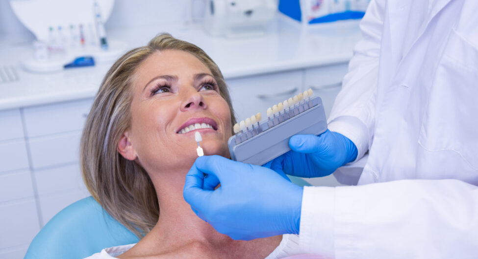 doctor-holding-tooth-whitening-equipment-by-patien-2021-08-28-16-46-04-utc